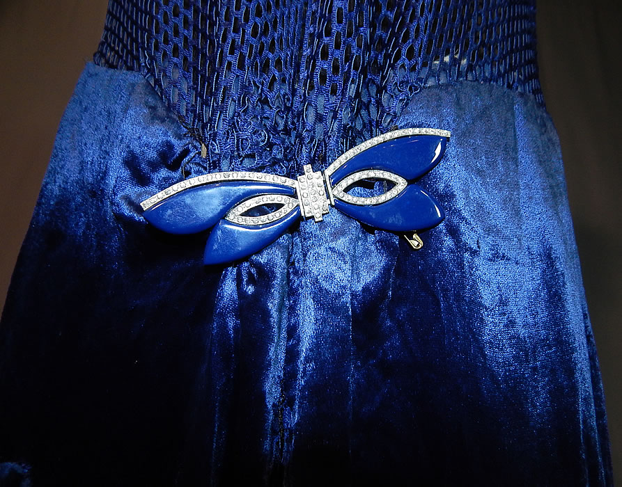 Vintage Art Deco Blue Silk Velvet Mesh Top Rhinestone Butterfly Buckle Flapper Dress
This fabulous flapper dress has a sheer see through mesh sleeveless tank top, with V front neckline, slight drop waist, blue enamel rhinestone butterfly buckle clasp trim pinned onto the front waist, a full skirt which is lined and unlined top.