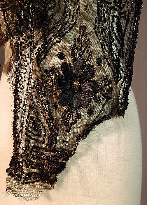 Edwardian Black Net Silk Embroidered Beaded Dress Trim Shawl Collar
The trim measures 55 inches long and 8 inches wide at the widest area. It is in good as-is condition, with some loose missing beads and frayed ends (see close-ups). This is truly a wonderful piece of wearable art which would be great for design or restoration!