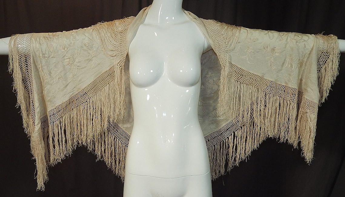 Antique Edwardian Cream Silk Embroidered Fringe Piano Shawl Wedding Cape
The shawl measures 74 inches long and 30 inches wide. It is in good condition. This is truly a wonderful piece of wearable textile art!