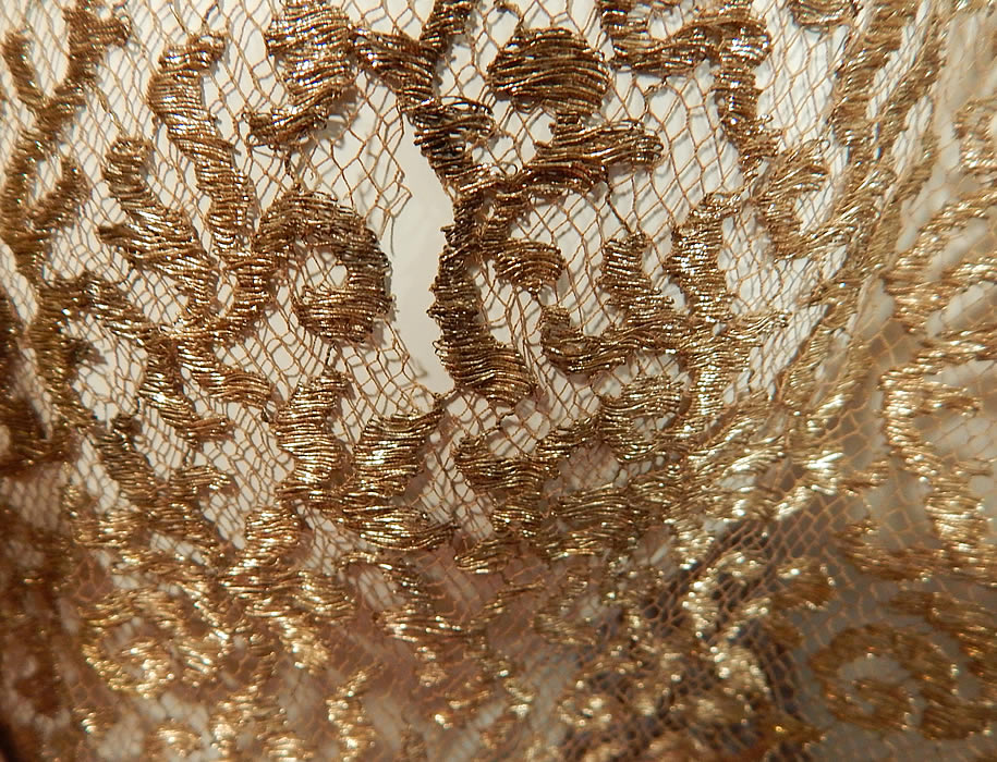 Vintage Art Deco Gold Metallic Lam&eacute; Lace Bias Cut Evening Gown Dress
It is in good condition needing only some minor restoration repair, with a small hole on one shoulder strap, a few tiny pulls snags on back skirt, 1 inch fray under the arm and a 1/2 inch frayed rip on the back (see close-ups).