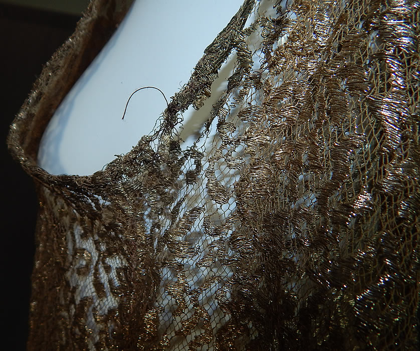 Vintage Art Deco Gold Metallic Lam&eacute; Lace Bias Cut Evening Gown Dress
It is in good condition needing only some minor restoration repair, with a small hole on one shoulder strap, a few tiny pulls snags on back skirt, 1 inch fray under the arm and a 1/2 inch frayed rip on the back (see close-ups).