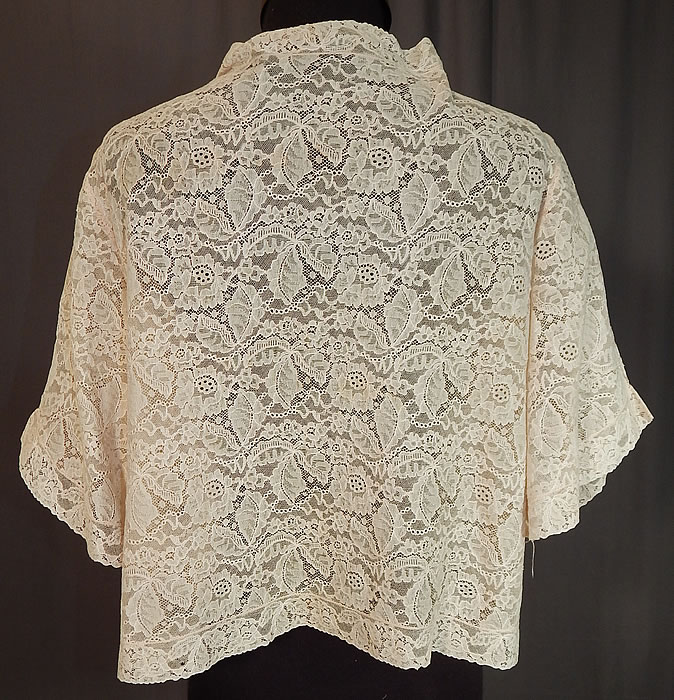 Vintage Forget Me Not Rosette Trim Cream Lace Cropped Bolero Boudoir Bed Jacket
The top measures 18 inches long, with a 38 inch waist and 36 inch bust. It is in excellent condition. This is truly a wonderful piece of wearable lingerie lace art!