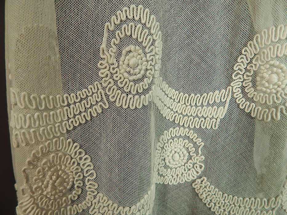 Vintage Girls White Sheer Tulle Net Soutache Ribbon Embroidery Drop Waist Dress
This girls pretty party dress has a loose fitting drop waist style, with raised scalloped trim side hips, neckline short sleeve cuffs,a key hole opening back with button closures and is sheer, unlined.