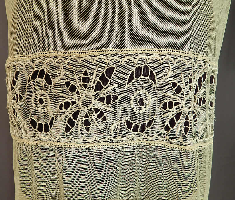 Vintage Cream Sheer Tulle Net Eyelet Cutwork Lace Floral Drop Waist Dress
This lovely lace dress is loose fitting, with a drop waist, short sleeves, full skirt, snap closures on the back and is sheer, unlined.
