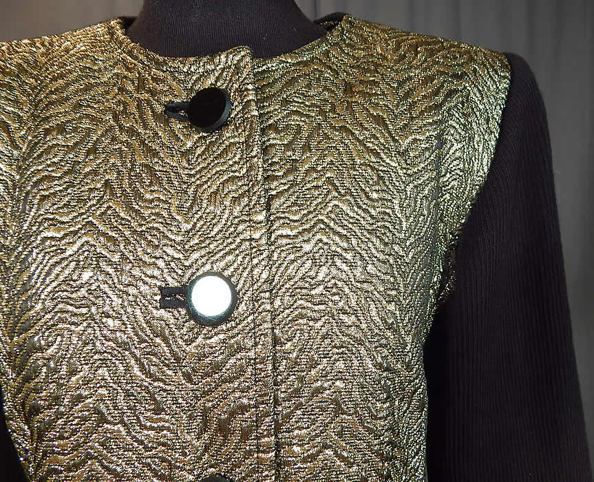 Vintage Saint Laurent Rive Gauche Gold Lam&eacute; Black Knit Suit Jacket
This beautiful designer suit jacket has broad shoulder padding, long fitted sleeves, black jet buttons for closure down the front and is fully lined. 