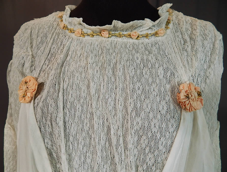 Edwardian White Cotton Lace Pink Silk Rosette Ribbon Trim Pinafore Dress
This lovely lace dress is a long tea length, with a pinafore style, attaching to the lace top with rosette covered snaps on both the front and back, , 3/4 length sleeves, a fitted waistband, snap closures down the back and is unlined with a sheer top.