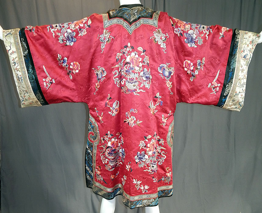 Antique Chinese Red Silk Embroidered Forbidden Stitch Sleeve Band Cuff Qipao Robe
This magnificent Manchu womens qipao one piece dress style robe is loose fitting, a long mid length, with a rounded neckline, wide full long sleeves, a front side opening, black silk loops, round brass button toggle closures which are loose and is fully lined in a blue silk.