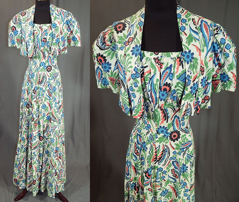 Vintage Colorful Cotton Floral Leaf Print Maxi Dress & Cropped Bolero Jacket
This vintage colorful cotton floral leaf print maxi dress and cropped bolero jacket dates from the 1940s. It is made of a colorful pink, blue, green, black and white abstract floral leaf print cotton fabric.