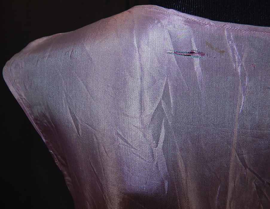 Vintage Iridescent Lavender Silk Taffeta Lace Trim Smocking Drop Waist Dress
The dress is a small size for a youth, young miss and measures 34 inches long, with a 28 inch waist and 32 inch bust. It is in fair as-is condition, with a few tiny snag pulls on the fabric top and a frayed split with faint stain on the back top (see close-up). This is truly a wonderful piece of wearable art!