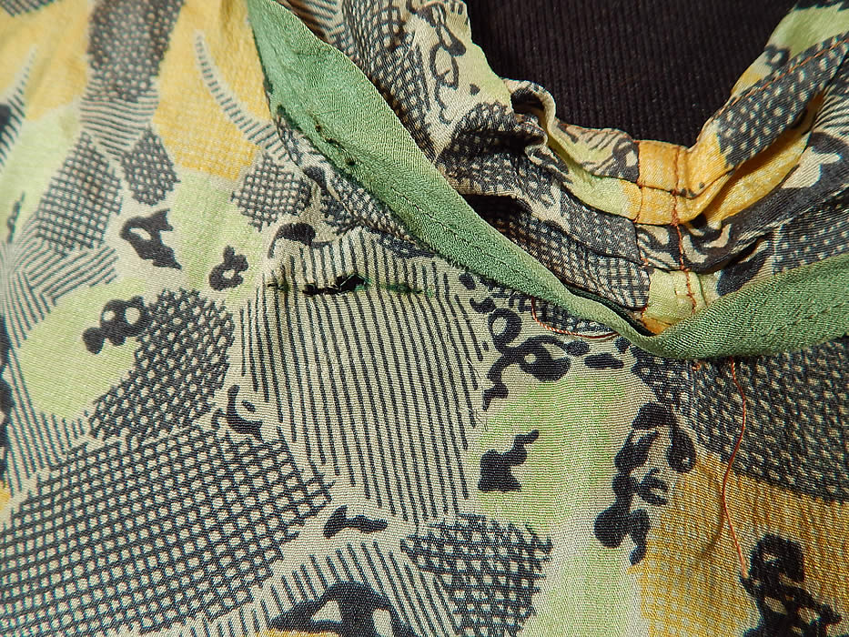 Vintage Black & White Yellow Daisy Print Silk Sailor Collar Drop Waist Dress
The dress measures 39 inches long, with a 34 inch waist and 38 inch bust. It is in good as-is condition, with faint underarm stains and a small frayed split under the front collar (see close-ups). This is truly a wonderful piece of wearable art!