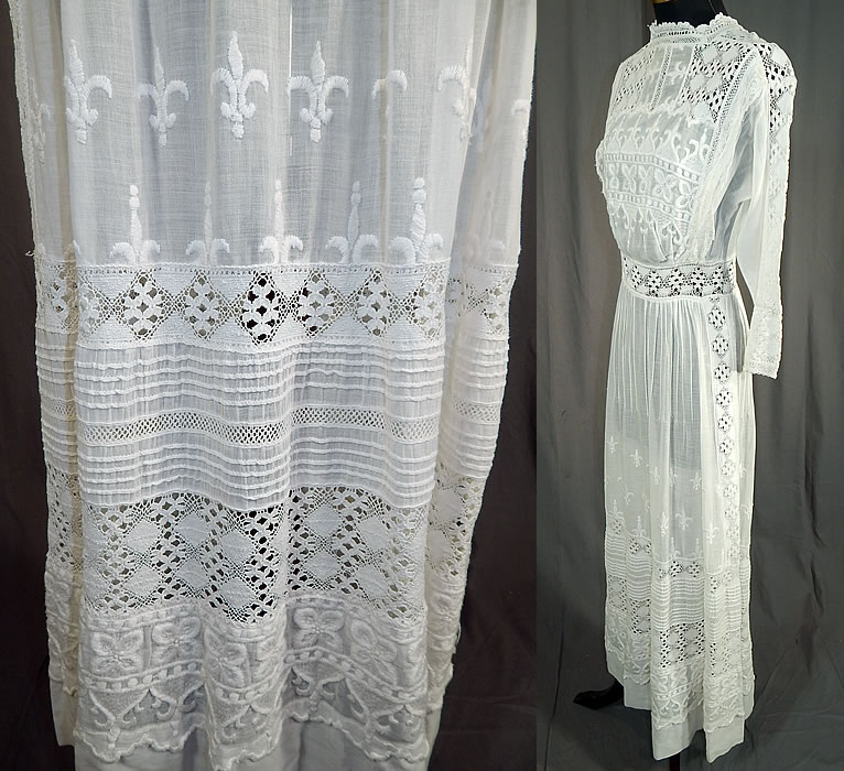 Edwardian White Cotton Batiste Fleur-de-lis Embroidered Lace Lawn Dress Tea Gown
This lovely lace lawn dress is a long tea length, with a lace trim high neckline, fitted waistband, long sleeves, button closures down the back and is sheer, unlined.