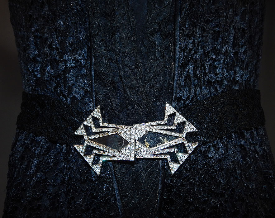 Vintage Art Deco Buckle Belted Black Silk & Chantilly Lace Flapper Dress
It is in good as-is condition, with a small frayed hole under one arm and the buckle clasp is missing some rhinestones including 2 larger stones in the center (see close-ups). This is truly a wonderful piece of wearable Art Deco textile art!