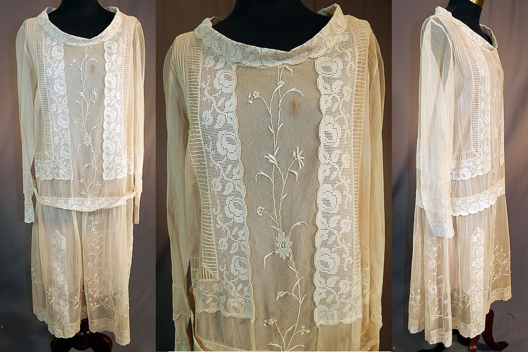 Vintage Cream Net Embroidered French Knot Filet Lace Pink Silk Slip Drop Waist Dress
This vintage cream net embroidered French knot filet lace pink silk slip drop waist dress dates from the 1920s. It is made of an off white cream color sheer tulle net fabric with raised padded satin stitch and French knot embroidery work done in a floral vine leaf design and rose pattern filet lace trim edging accents. 