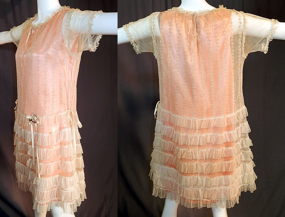 Vintage Embroidered Cream Net Lace Silk Ribbon Rosette Trim Peach Slip Dress
The dress measures 36 inches long, with 38 inch hips, a 38 inch waist and 36 inch bust. 