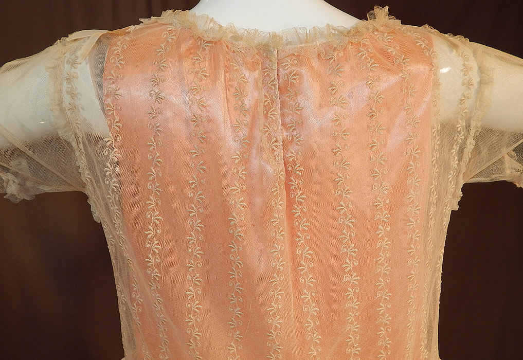 Vintage Embroidered Cream Net Lace Silk Ribbon Rosette Trim Peach Slip Dress
It is in excellent condition. This is truly a sweet piece of Lolita fashion, antique lace wearable art!