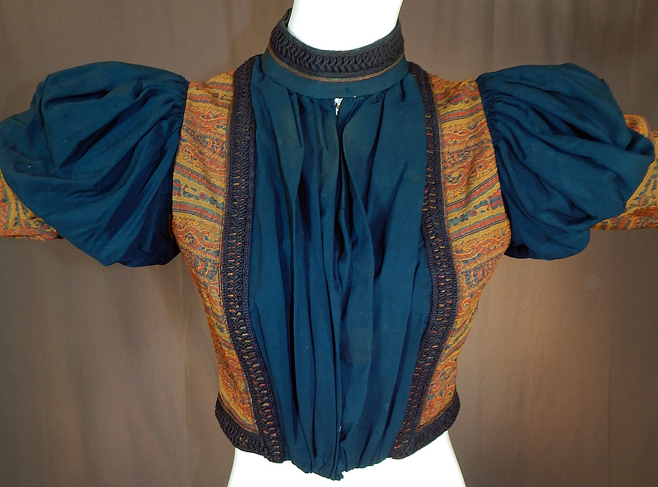 Victorian A.E. Parsons Boston Paisley Brocade Navy Blue Wool Gigot Mutton Sleeve Bodice
It is made of a navy blue and gold, red, blue paisley brocade boteh pattern woven wool fabric.