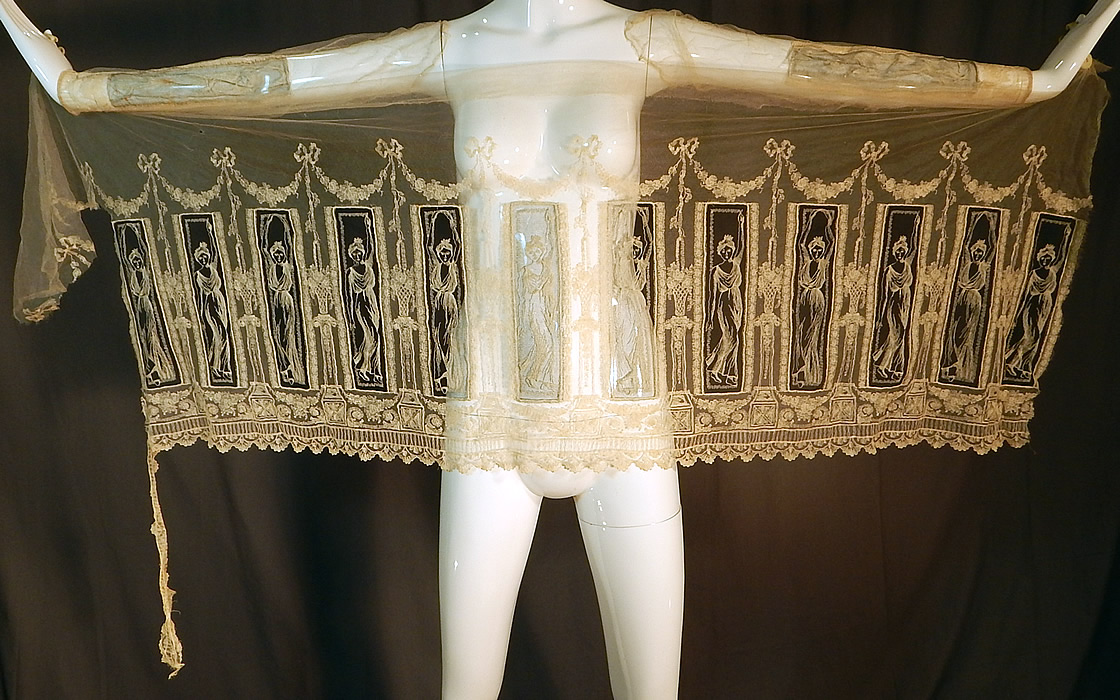 Vintage Grecian Goddess Figural Embroidered Net Lace Dress Skirt Fabric
This vintage Grecian Goddess figural embroidered net lace dress skirt fabric dates from the 1920s. It is made of a off white cream color sheer net tulle fabric, with finely done embroidery work of beautiful Grecian Goddess women posing and highlighted on a sheer black net background.