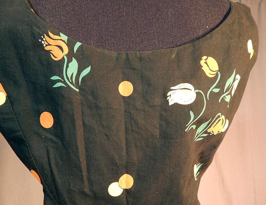 Vintage Black Cotton Polka Dot Tulip Novelty Print Fit & Flare Circle Skirt Dress
The dress measures 47 inches long, with a 26 inch waist and 34 inch bust. It is in excellent condition. This is truly a wonderful piece of vintage textile art!