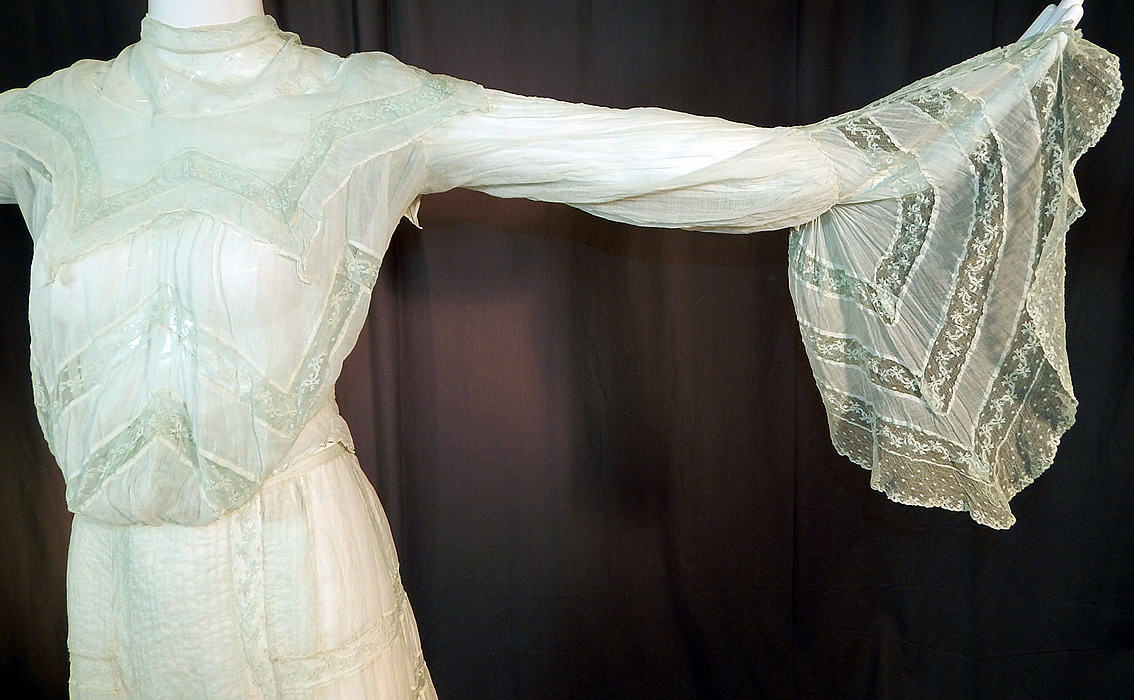 Edwardian Blue Batiste Lace Dress Handkerchief Sleeve Blouse & Skirt Train
The top measures 18 inches long, with a 22 inch waist, 38 inch bust and 19 inch long sleeves, with additional 14 inch long cuffs. 