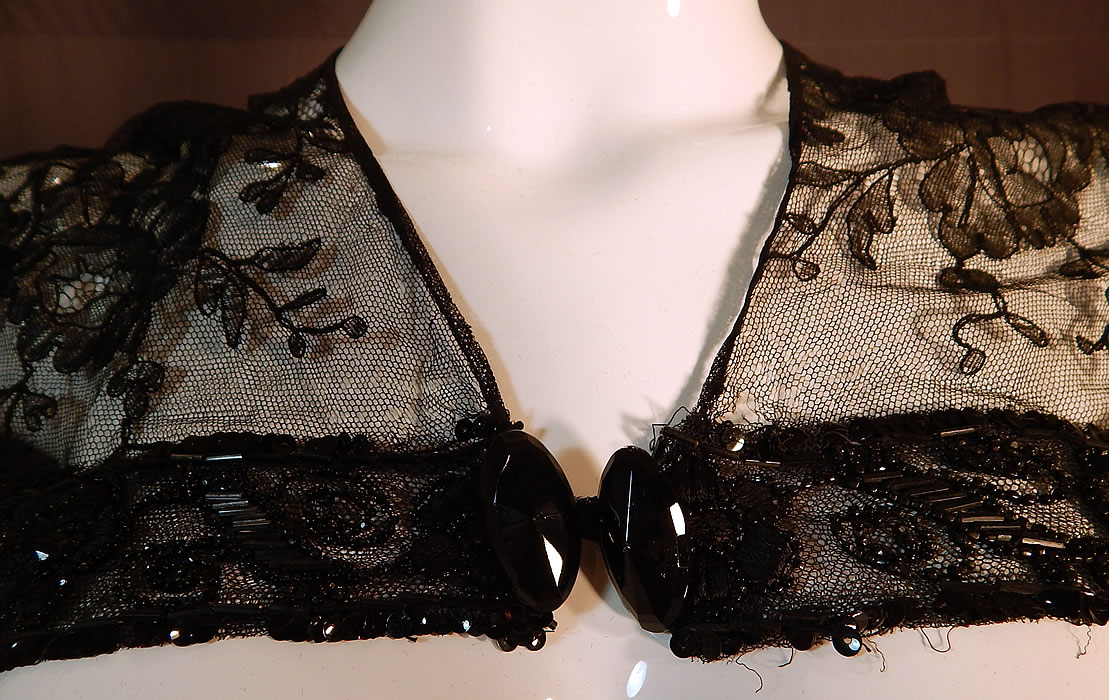 Victorian Black Chantilly Lace Jet Beaded Shawl Collar Fichu Pelerine Cape
This stunning short cape capelet fichu pelerine shawl collar has a black faceted glass oval shaped button closure and is sheer, unlined.