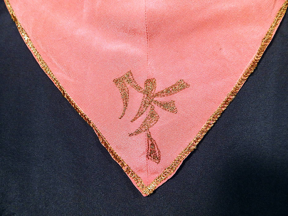 Vintage Art Deco Navy Blue Pink Silk Gold Embroiderd Dress & Jacket
The dress measures 40 inches long, with a 36 inch waist and 36 inch bust. There is a matching fabric navy blue jacket, loose fitting, with an open front, wrap around sash strap waistband with snap closures, long sleeves with pink silk gold trim cuffs and is unlined. 