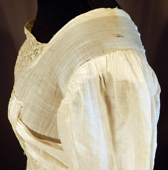 Victorian Cream Cotton Batiste Embroidery Applique Lace Lawn Dress Tea Gown
It is in fair as-is condition, needing some minor restoration, has not been cleaned with slight faint yellowing staining in areas, a mended repair on the back top and some small frayed holes along the shoulders (see close-up). Great for design! This is truly a wonderful piece of wearable antique lace art which could be worn as a wedding or graduation dress!