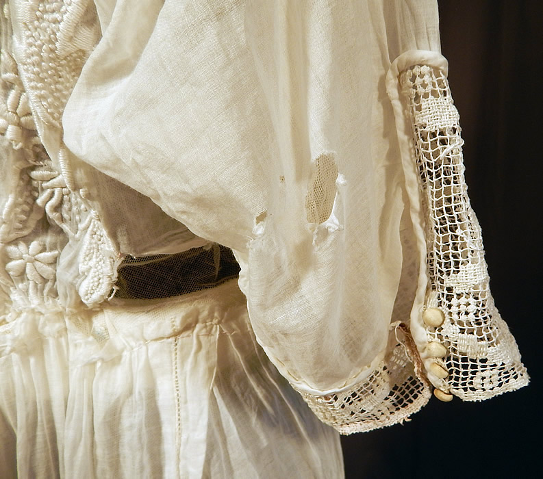Edwardian Titanic Embroidered French Knot Batiste Filet Lace Lawn Dress Tea Gown
The dress measures 59 inches long, with a 24 inch waist and 36 inch bust. It is in fair as-is condition, needing some restoration, with several small frayed holes scattered in areas and sleeve damage (see close-ups). 