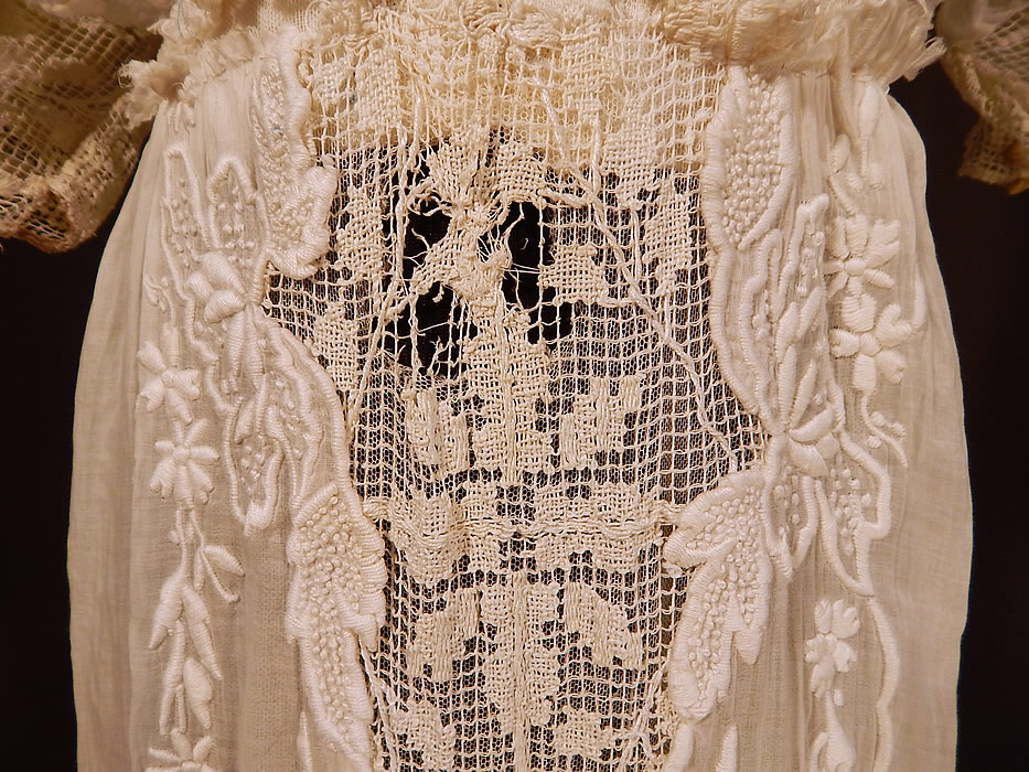 Edwardian Titanic Embroidered French Knot Batiste Filet Lace Lawn Dress Tea Gown
The dress measures 59 inches long, with a 24 inch waist and 36 inch bust. It is in fair as-is condition, needing some restoration, with several small frayed holes scattered in areas and sleeve damage (see close-ups). 