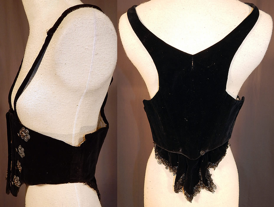 Victorian Black Velvet Silver Trim Swiss Waist Corselet Corset Vest Bodice
This stunning Swiss waist style sleeveless vest corselet corset bodice has a boned underbust style coming to a point at the bottom, racer back style shoulder straps, a black lace jet beaded trim flounce drape back at the bottom, hook closures down the front and is fully lined in cotton twill weave fabric.