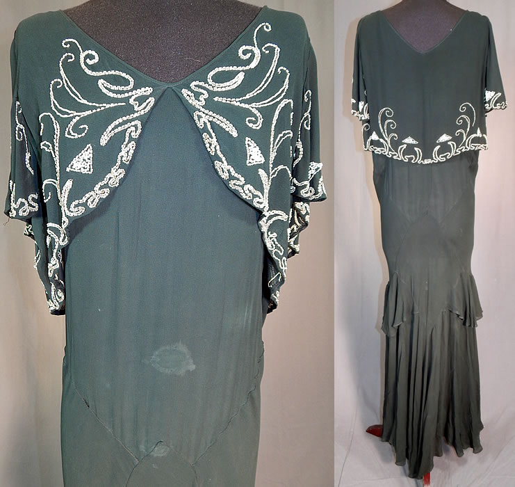 Vintage Black Silk Chiffon Butterfly Beaded Bias Cut Evening Gown Dress
It is in fair as-is condition, has not been cleaned, with some white staining discoloration on the front skirt, bottom hemline, under the arms and has a few frayed small holes on the shoulder (see close-ups).
