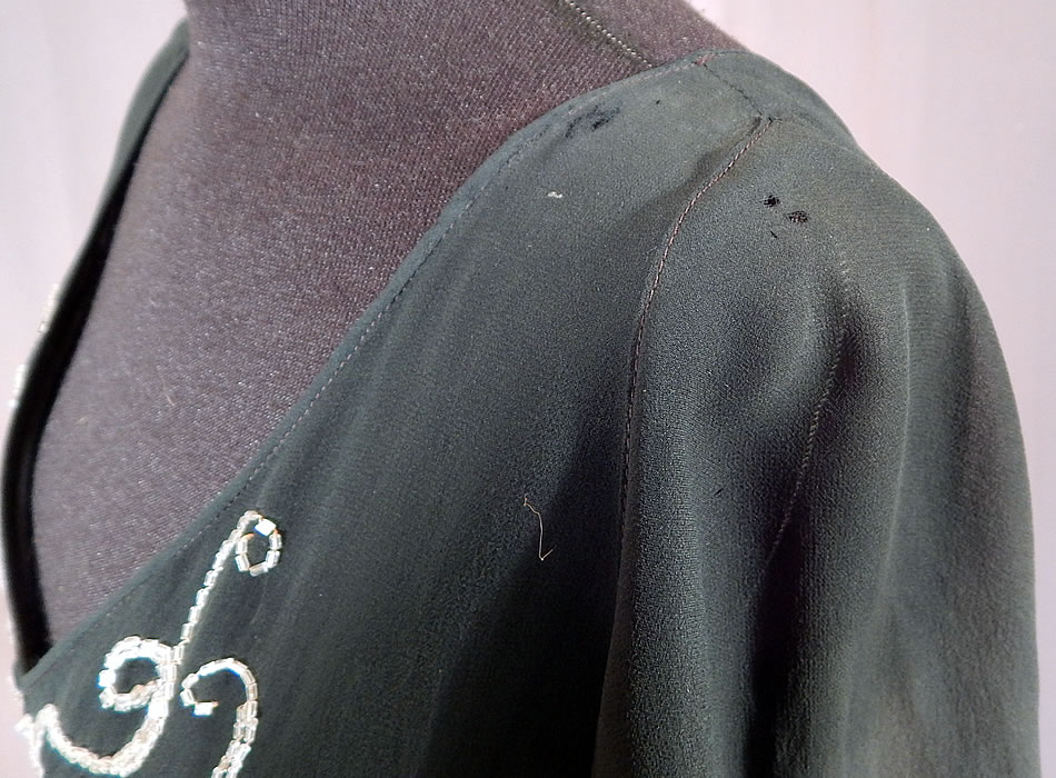 Vintage Black Silk Chiffon Butterfly Beaded Bias Cut Evening Gown Dress
It is in fair as-is condition, has not been cleaned, with some white staining discoloration on the front skirt, bottom hemline, under the arms and has a few frayed small holes on the shoulder (see close-ups). It would be great for design. This is truly a wonderful piece of wearable Art Deco textile art!
