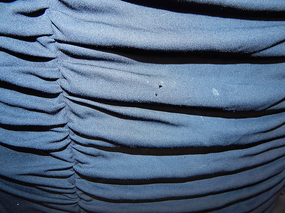 Vintage Heiress Swiss Made Black Silk Jersey Pleated Ruched Sheath Cocktail Dress
The dress measures 42 inches long, with 32 inch hips, a 24 inch waist and 32 inch bust. It is in good condition, with only two tiny moth nip holes on the front skirt (see close-up). This is truly a wonderful piece of wearable art! 