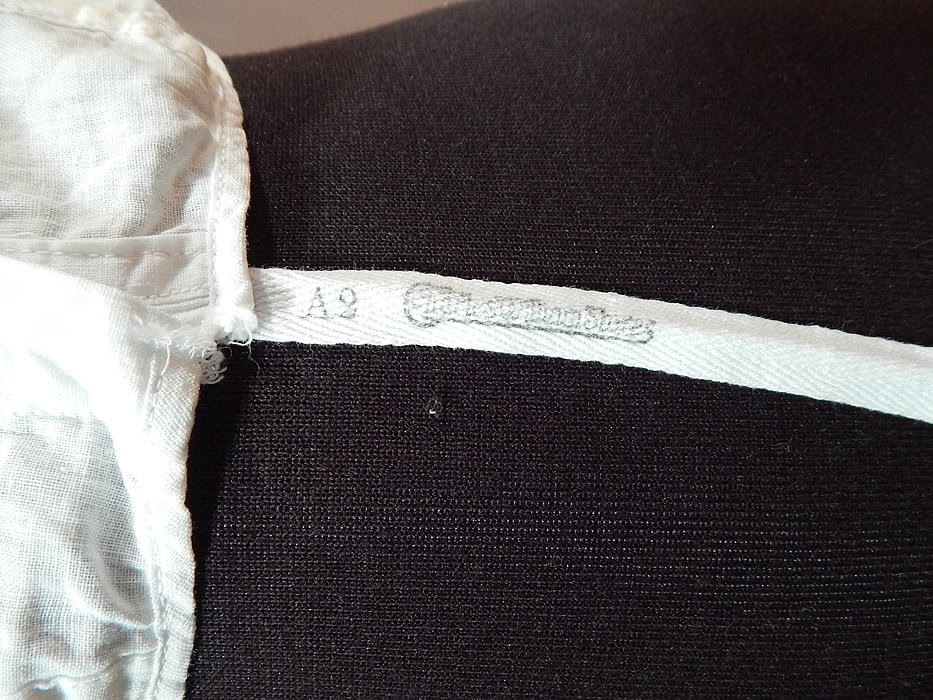 Vintage Edwardian White Cotton Camisole Corset Cover Stays Boning Bra Top
It is made of a white cotton muslin fabric. This early bra corset cover camisole top undergarment has stays, boning sewn inside the front for structure and support, hook closures down the front, reinforced underarm pads, a scalloped trim neckline, armholes and a bottom cloth label tag stamped "Charles William Stores".