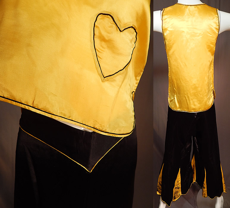 Vintage Chinese Black & Yellow Silk Embroidered Pajamas Palazzo Pants Robe Top
There are matching palazzo pants, with flared, pleated, scalloped, embroidered inserts bottom cuffs and a V front top elastic back waistband. The pants measure 39 inches long, with a 23 inch inseam, 40 inch hips and a 34 inch waist. It is in good condition, with only the pants back elastic waistband being a bit loose. This is truly a rare and amazing piece of wearable Asian textile art!