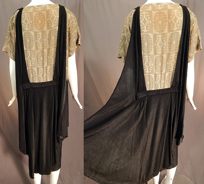 Vintage Art Deco Silk Print Top Black Jersey Knit Pinafore Dress & Beaded Belt
There is a beautifully beaded colorful belt trim with a painted carved wooden center medallion of a picturesque home. This unique style one piece drop waist dress has an attached pinafore overdress with a loose fitting, wide panel sides, flared skirt, belted waistband with beaded front trim, short sleeves, a squared neckline and is unlined. 