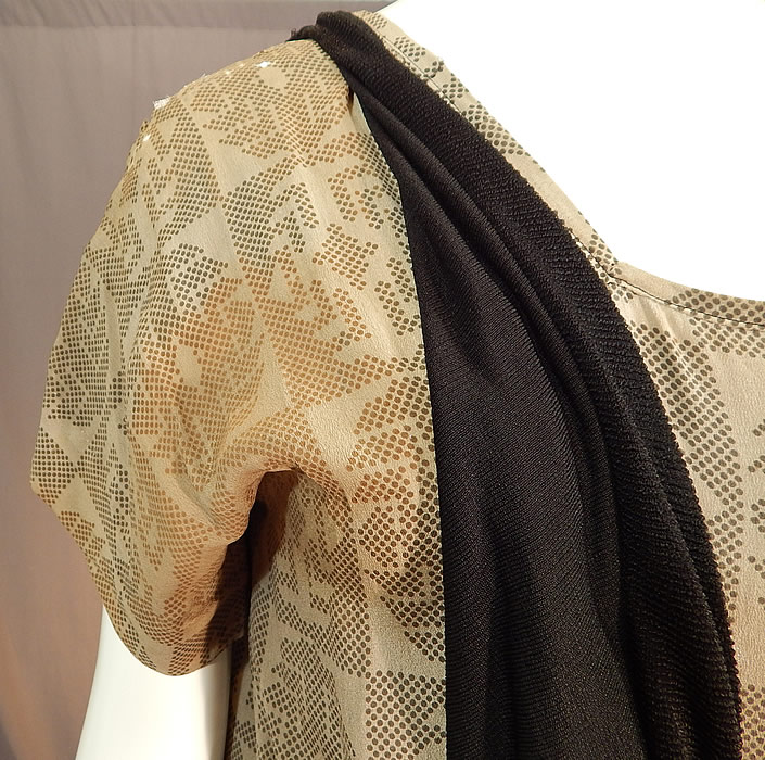 Vintage Art Deco Silk Print Top Black Jersey Knit Pinafore Dress & Beaded Belt
It is in fair as-is condition, with several frayed splits on the silk top along the shoulders, underarms, tiny holes on the back top and staining discoloration on the back and underarms (see close-ups). 