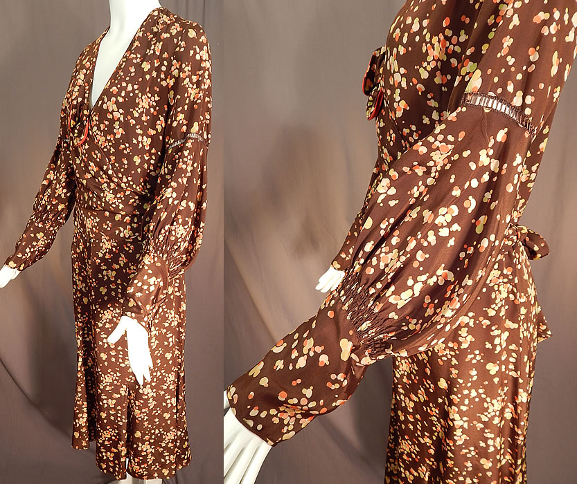 Vintage Brown Silk Polka Dot Bubble Print Belted Wrap Bias Cut Dress
This beautiful brown bias cut dress has an adjustable wrap style top belted waist, with an attached coral silk dickey top insert underneath, bow trim accent on the top, long full sleeves with drawn cut work on the arm, tapered gathered fitted cuffs, a V front neckline and is unlined.