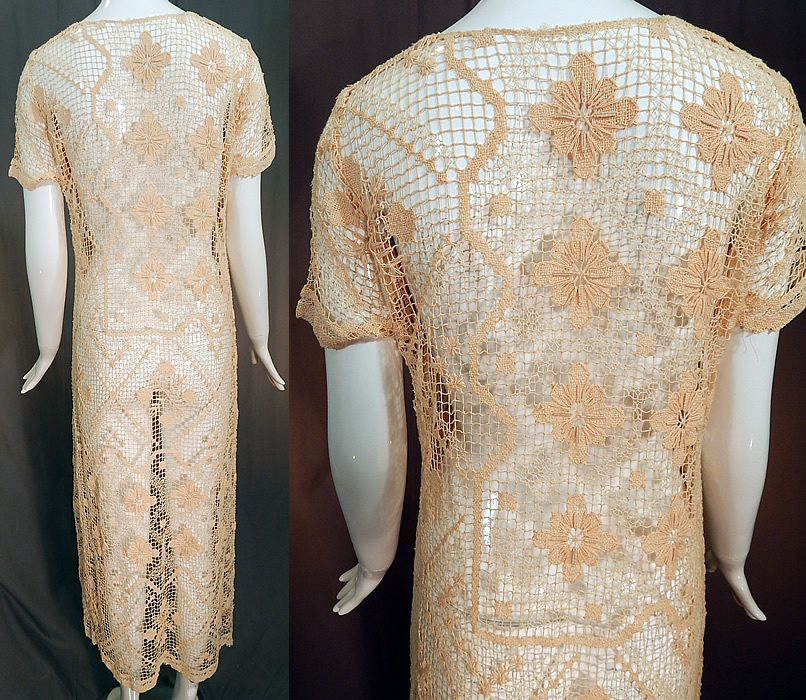 Vintage Boho Cream Crochet Lace Mesh Net Fishnet Side Slit Skirt Shift Dress
This lovely lace loose fitting straight shift style dress has high slits along the skirt sides, short sleeves, a V neckline and is sheer, unlined. 