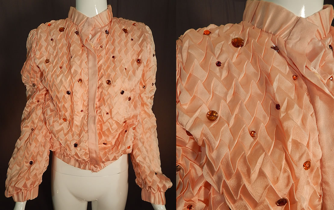 Vintage Krizia Martha Palm Beach Label Pink Silk Smocking Bejeweled Jacket
This vintage Krizia, Martha Palm Beach label pink silk smocking bejeweled jacket dates from the 1960s.