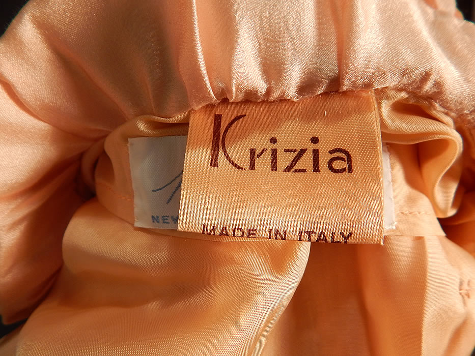 Vintage Krizia Martha Palm Beach Label Pink Silk Smocking Bejeweled Jacket
There is a "Krizia Made in Italy" and "Martha Palm Beach" labels size 40 tag sewn inside. The jacket measures 21 inches long, with a 36 inch bust, 28 inch bust and 23 inch long sleeves. It is in excellent condition. This is truly a wonderful piece of wearable art!