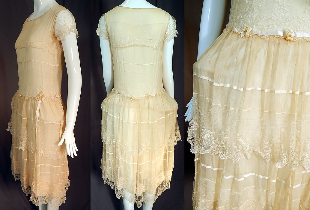 Vintage Robe de Style Yellow Cream Silk Rosette Ribbon Lace Pannier Hoop Dress
It has a drop waist style with pannier skirt hip extenders sewn underneath creating a low and wide flared hips style, a layered lace ruffle skirt, lace short cap sleeves and is fully lined in an off white cotton fabric.