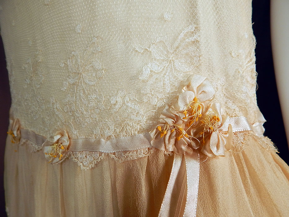 Vintage Robe de Style Yellow Cream Silk Rosette Ribbon Lace Pannier Hoop Dress
It is in good as-is condition, with a few tiny holes on the lace sleeves and a small fray along the shoulder. This is truly a wonderful piece of wearable textile art which could be worn as a bridal wedding dress!