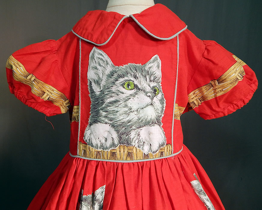 Vintage Girls Red Cotton Kitty Cat Kitten Basket Novelty Print Circle Skirt Dress
It is made of a red cotton fabric, with adorable green eyed, gray tabby kitty cats kittens sitting in a basket novelty print design. 