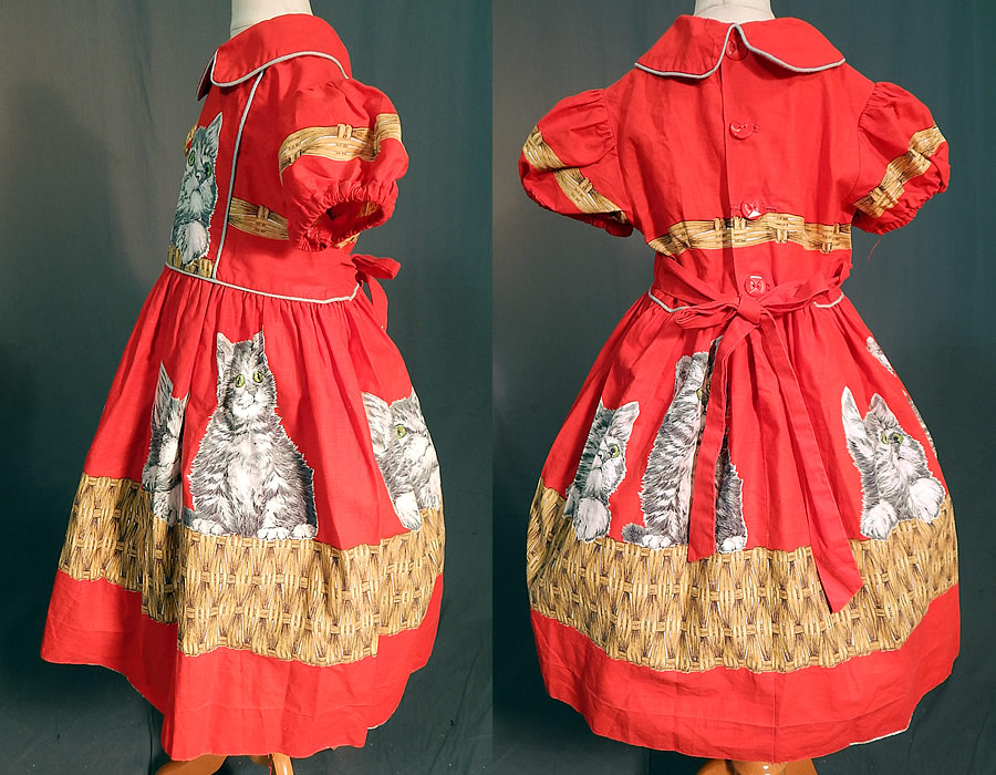 Vintage Girls Red Cotton Kitty Cat Kitten Basket Novelty Print Circle Skirt Dress
This cute cat little girls party dress has a peter pan collar, short puffy sleeves with elastic cuffs, red plastic button closures down the back, an attached belted back tie sash, full circle skirt and is unlined. 