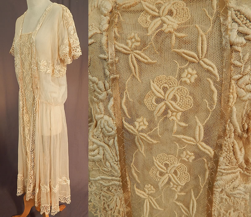 Vintage Cream Tulle Net French Knot Embroidered Floral Lace Drop Waist Dress
It is made of an off white cream color sheer tulle net fabric with raised padded satin stitch, French knot embroidery work done in floral vine leaf designs, cluny bobbin lace trim edging down the center panel front & back, bottom skirt hemline and sleeve cuffs. 