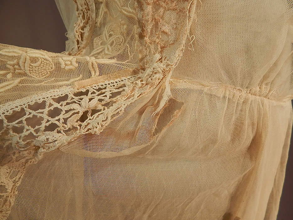Vintage Cream Tulle Net French Knot Embroidered Floral Lace Drop Waist Dress
There are a few faint small stains, tiny pin holes on the back top, loose stitching around the waist, small open seams under the arms and a small frayed hole at the front waist hidden underneath the lace trim panel (see close-ups). This is truly a wonderful piece of wearable lace art!