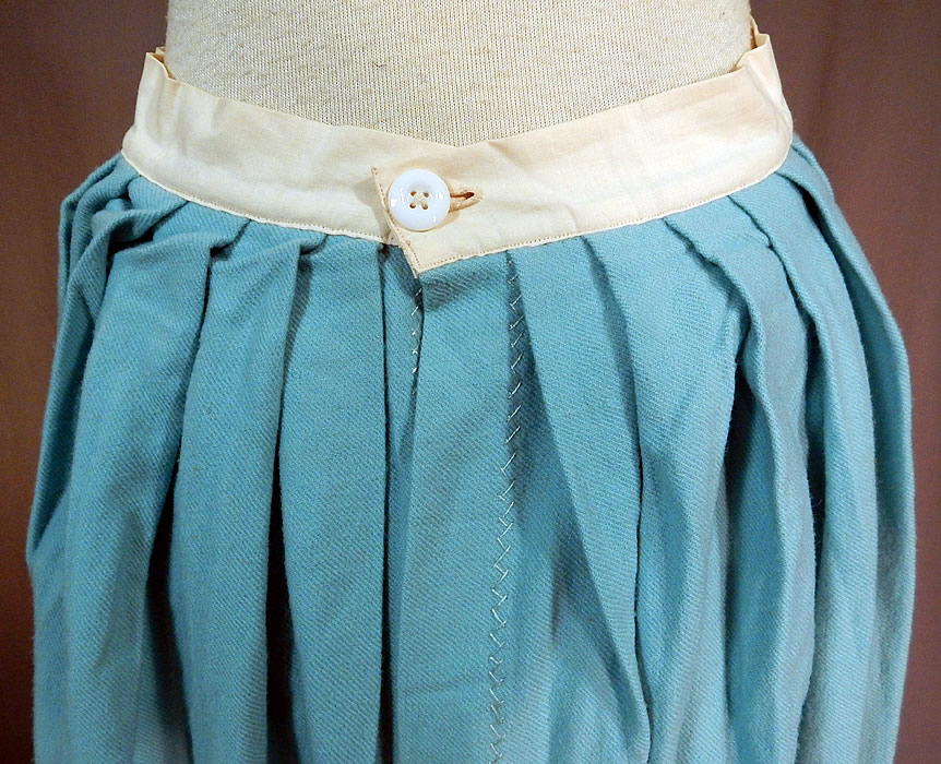 Victorian Robin Egg Blue Wool Embroidered Daisies Crochet Trim Petticoat Skirt
This beautiful blue winter petticoat full skirt is a long mid length with a fitted white linen waistband, button back closure with pleated gathers on the back, decorative white zig zag stitching details along the seams and is unlined. 