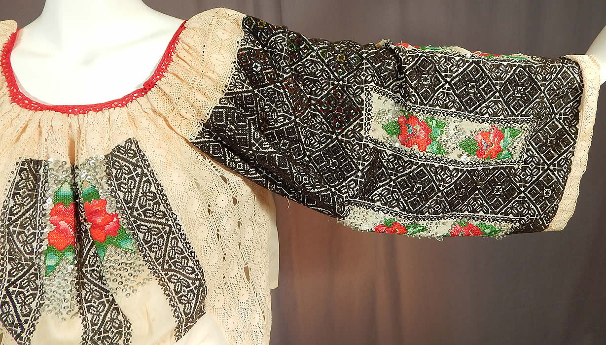 Vintage Romanian Hand Embroidery Black & White Lace Beaded Boho Peasant Blouse
It is made of an off white cream color newer nylon fabric, with older black and white cross stitch hand embroidery work front panel pieces and sleeves creating a patchwork style of new and old.