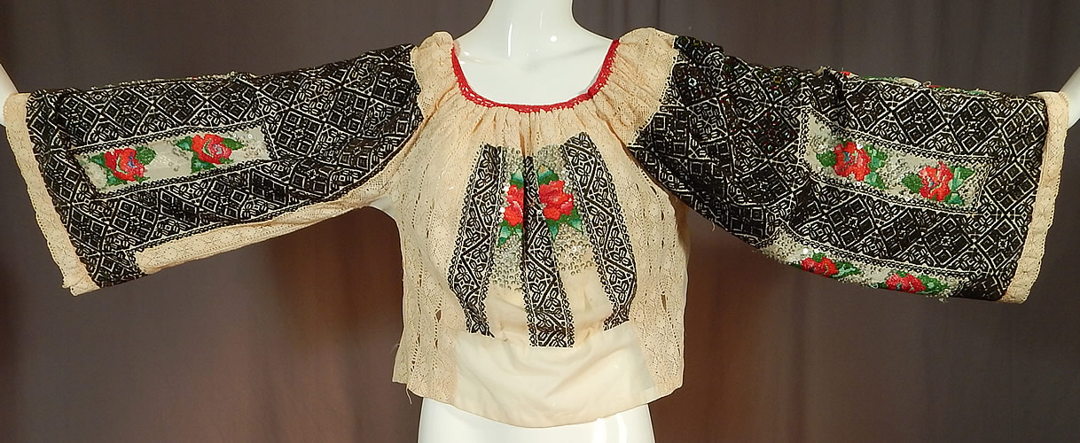 Vintage Romanian Hand Embroidery Black & White Lace Beaded Boho Peasant Blouse
The top measures 22 inches long, with a 38 inch bust, 38 inch waist and 22 inch long sleeves. 