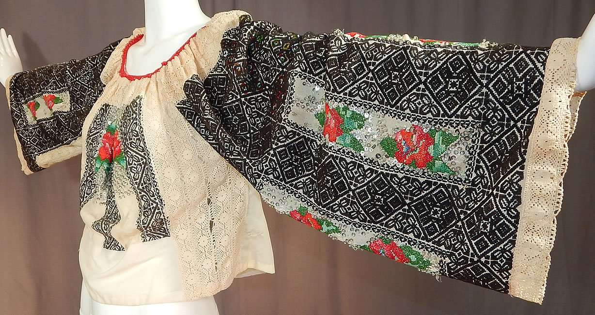 Vintage Romanian Hand Embroidery Black & White Lace Beaded Boho Peasant Blouse
This is truly a rare and wonderful piece of wearable Romanian peasant textile folk art! 